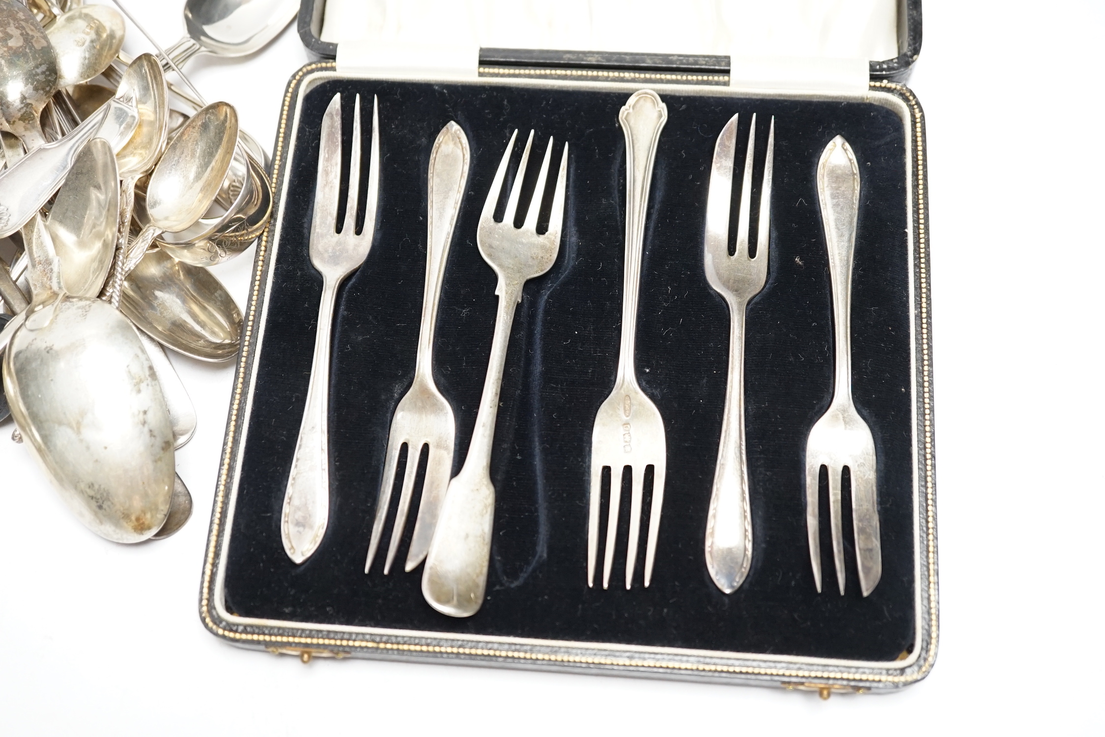 A quantity of assorted 19th century and later silver flatware, various dates, patterns and makers including a pair Georgian sugar nips, 30.2oz.